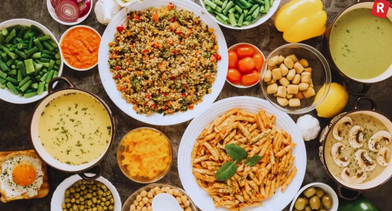 A plate featuring two types of high-protein Indian breakfast: a savory Besan Cheela and a bowl of mixed sprouts Usal, representing a satisfying High Protein Indian Vegetarian Breakfast.