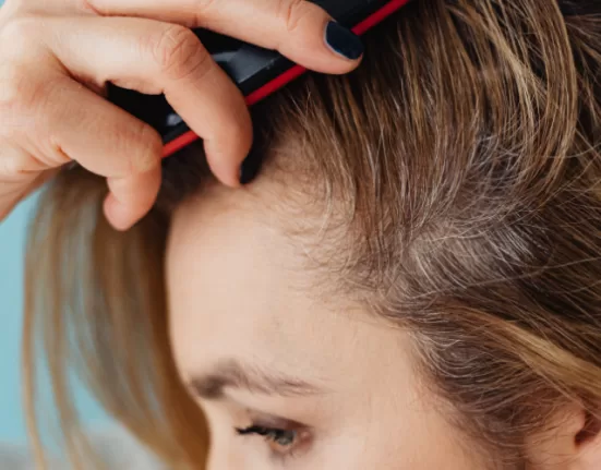 Fresh Amla and Bhringaraj leaves, key herbs in Ayurvedic Hair Care Tips.