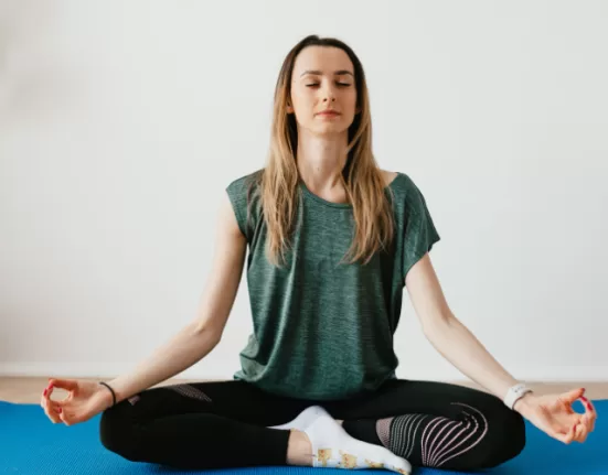A person demonstrating Child's Pose (Balasana), a top choice among Yoga Poses for Stress Relief for Beginners.