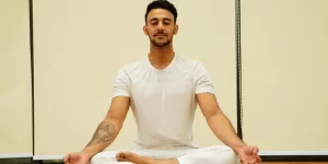 A woman practicing deep breathwork, a key component of Yoga Poses for Stress Relief for Beginners.