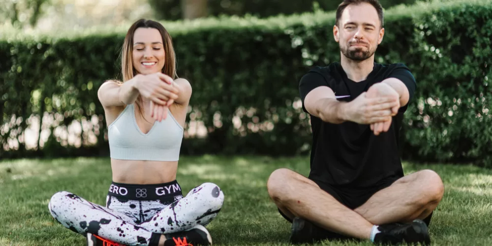 A person performing leg swings, a key part of the Dynamic Warm-Up Routine Before Workout.