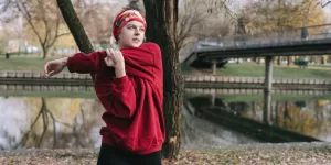 A graphic illustrating joint circles and arm rotations for a Dynamic Warm-Up Routine Before Workout.