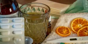 A person measuring blood pressure, symbolizing the need for Home Remedies for High Blood Pressure.