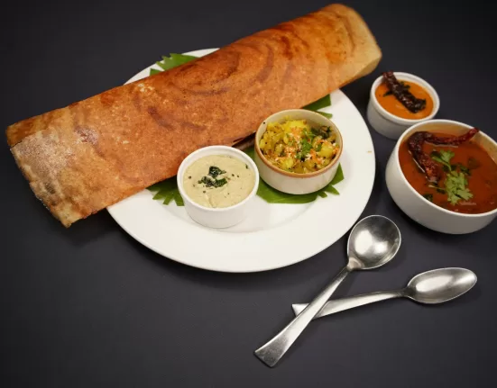 A plate featuring a balanced South Indian meal: brown rice, vegetable sambar, and a small bowl of yoghurt, representing the South Indian diet plan for weight loss.