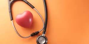 A clean EKG line, symbolizing a healthy heart function achieved through a strong 5 essential steps in the Routine to Optimize Heart Health.