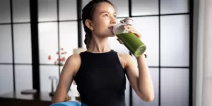 A person smiling while eating a low-calorie snack, symbolizing the enjoyment of Healthy Indian Snacks for Weight Loss.