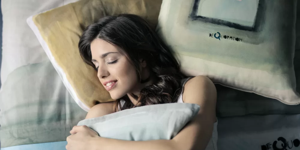 A person sleeping peacefully, applying Ayurvedic Tips for Insomnia.