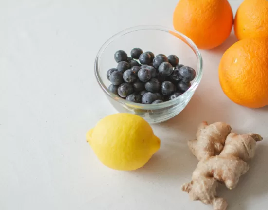 A collection of fruits and vegetables rich in the Vitamins to Boost Your Immunity (Citrus, Spinach, Eggs).