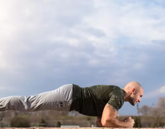 A person performing the Bird-Dog exercise, a key one among the Exercises to Fix Lower Back Pain.