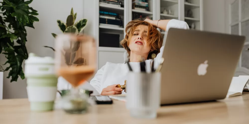 A person meditating next to a neatly organized budget sheet, symbolizing Financial Habits for Stress-Free Living.