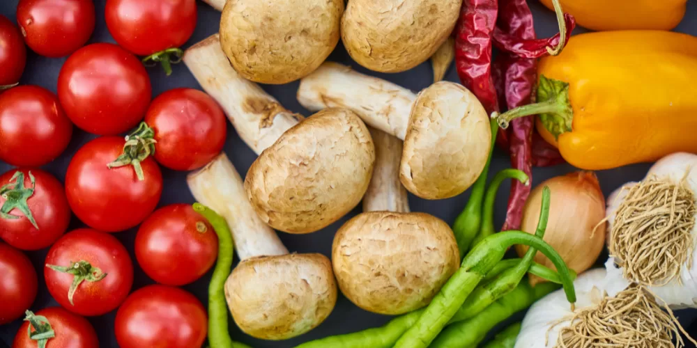 A selection of Vitamin C-rich foods and bone broth, the best Superfoods for Boosting Collagen.