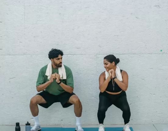 A person performing a modified push-up, demonstrating one of the Home Workouts for Beginners.