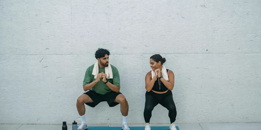 A person performing a modified push-up, demonstrating one of the Home Workouts for Beginners.