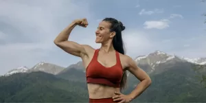 A person lifting weights, highlighting the result of Indian Foods for Muscle Gain.