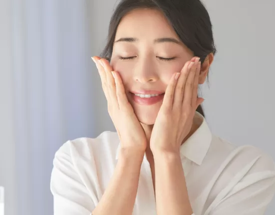 A serene woman with clear, glowing skin, representing the effect of an Ayurvedic Detox for Clear Skin.