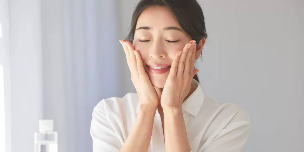 A serene woman with clear, glowing skin, representing the effect of an Ayurvedic Detox for Clear Skin.