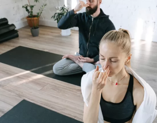 A person meditating, demonstrating Breathing Exercises for Stress Relief.