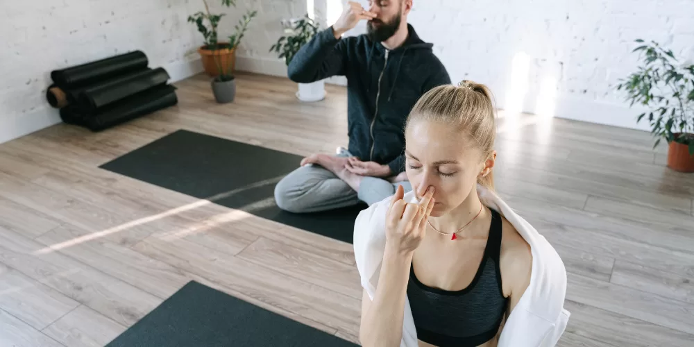 A person meditating, demonstrating Breathing Exercises for Stress Relief.